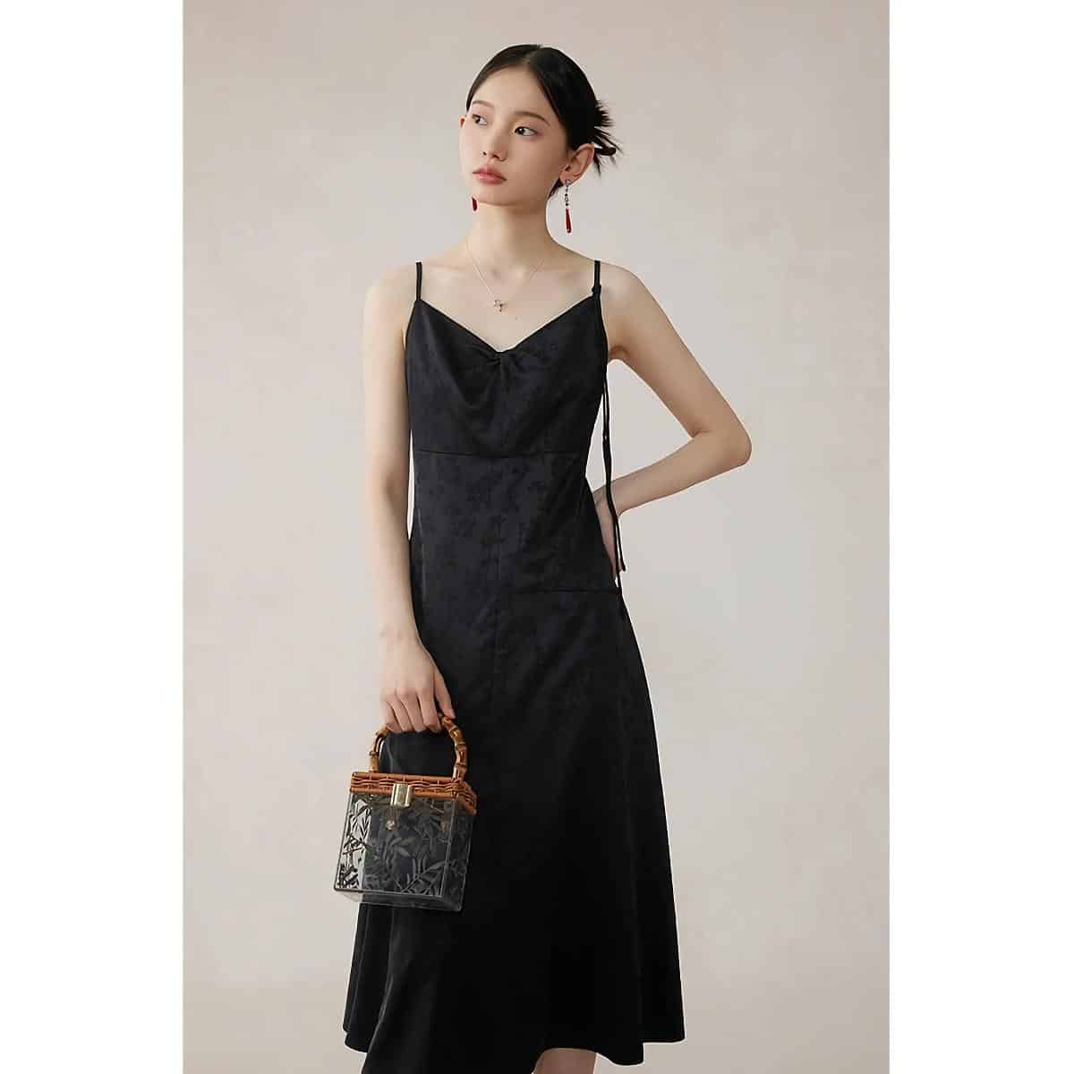 High-quality black slip dress with delicate details, perfect for fashionable women seeking elegant and trendy outfits. Crafted with premium materials for comfort and style.