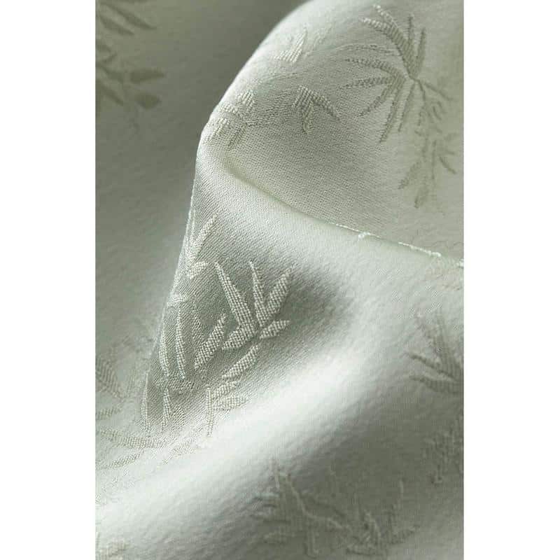 Luxurious ivory curtain featuring a subtle bamboo print, ideal for modern and traditional interiors, provides light control and style.