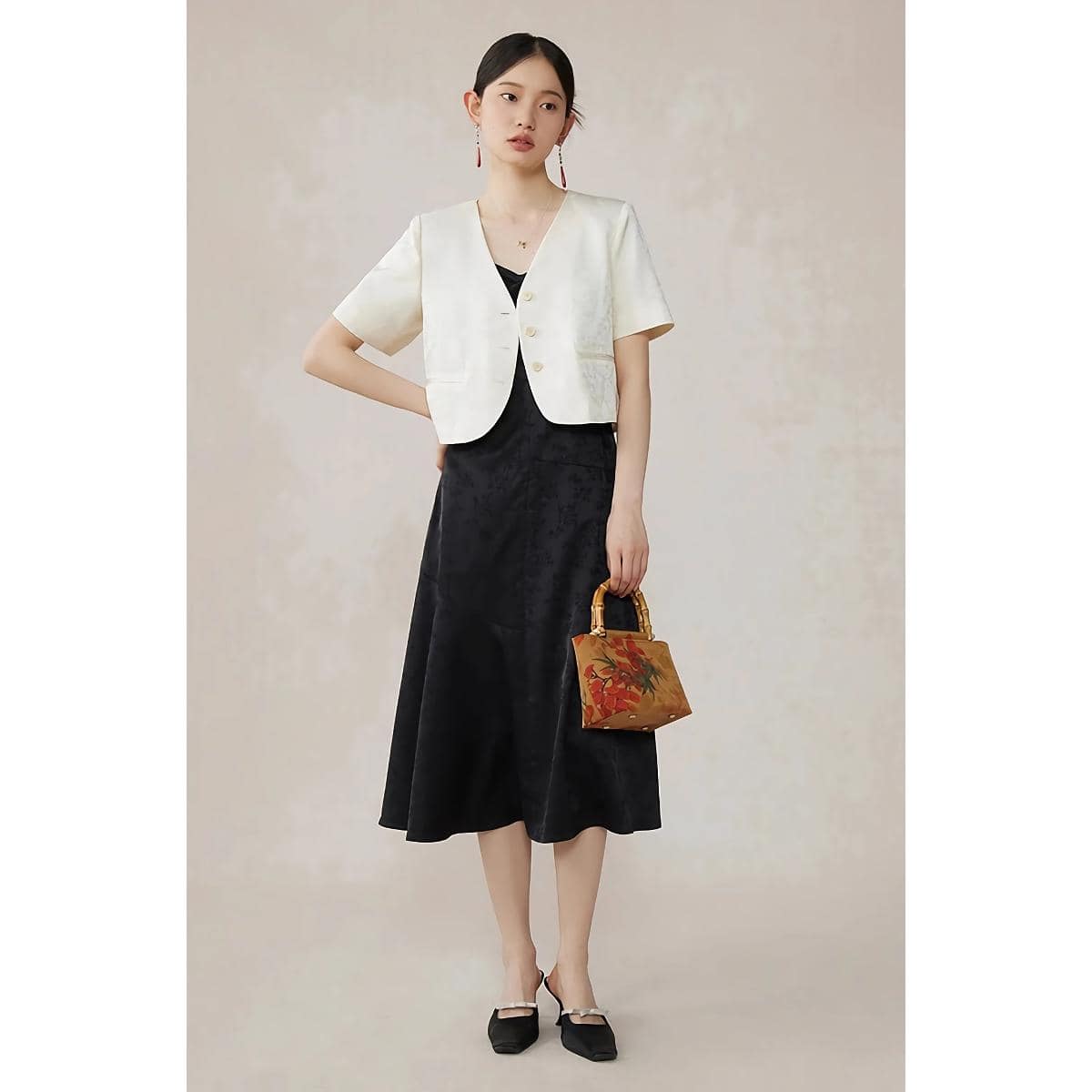 Sophisticated women's outfit featuring a stylish black dress and white blazer, perfect for Monalisa store options, luxury fashion, and modern accessories.