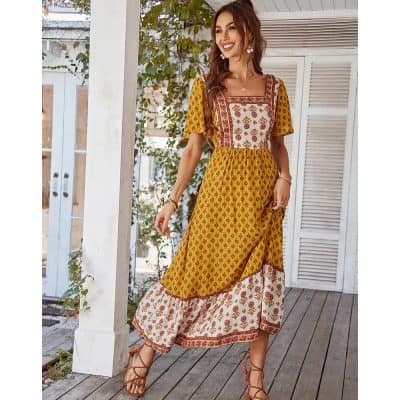 Stylish yellow and floral printed bohemian maxi dress for women, perfect for summer and outdoor events. Comfortable, trendy, and ideal for a fashionable, everyday look.