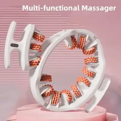 Circular white massage device with orange rotating bristles, shown on a pink pedestal; labeled “Multi-functional Massager.”