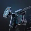 Futuristic car phone holder with a wireless charging pad and adjustable clamp, shown in metallic blue accents against a dark background.