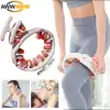 Person using a large circular massage roller with orange nodules on the thigh; AWW logo in the top-left corner.